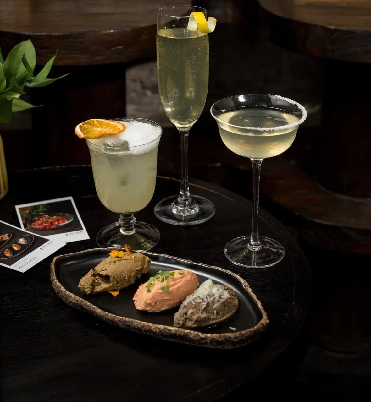 Cocktails and snacks on a table at PORCH